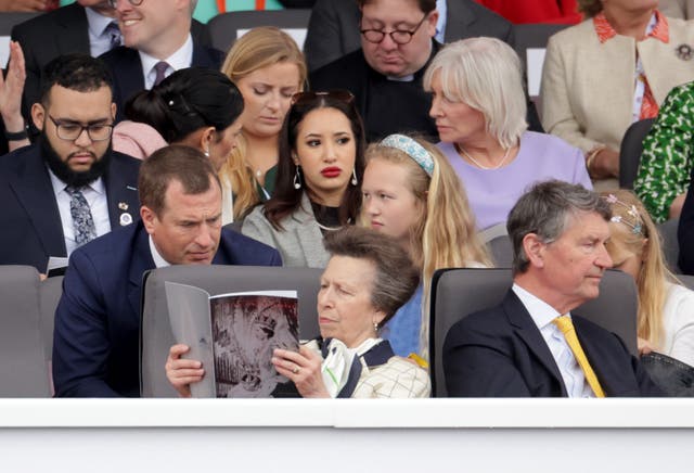 Anne reads from the programme with Peter Phillips at the Platinum Jubilee Pageant