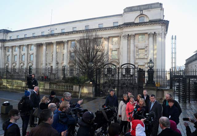 Loughinisland victims' family members and supporters address the media outside Belfast's High Court (Brian Lawless/PA)