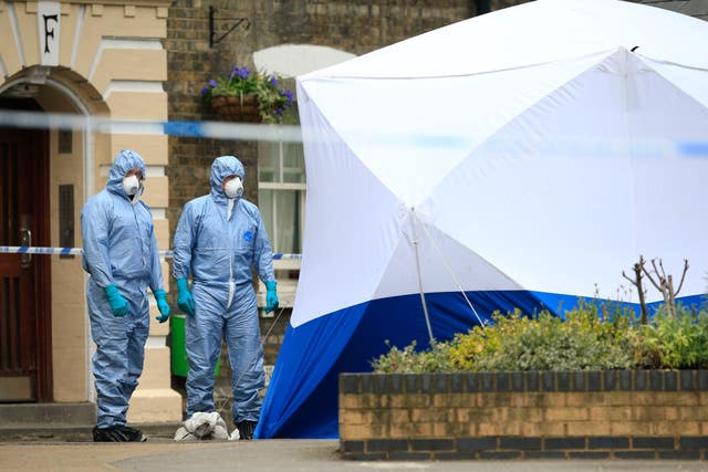 Police forensic officers after the remains of Gordon Semple were found (Jonathan Brady/PA)