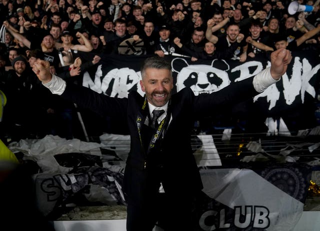 Stephen Robinson celebrates in front of the St Mirren fans