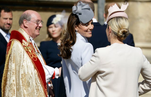 The Duchess of Cambridge shares a smile with Zara Tindall outside the church