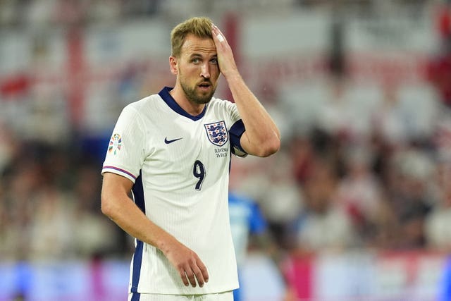 Harry Kane wipes sweat off his forehead during England''s game with Slovenia