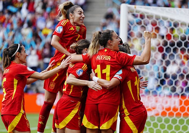 Spain’s Mariona Caldentey (hidden) celebrates with Alexia Putellas (right)