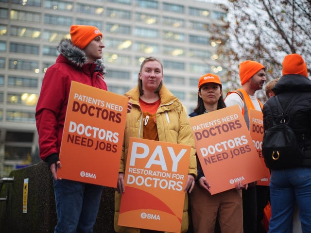 NHS resident doctors outside St Thomas’ Hospital in London in November