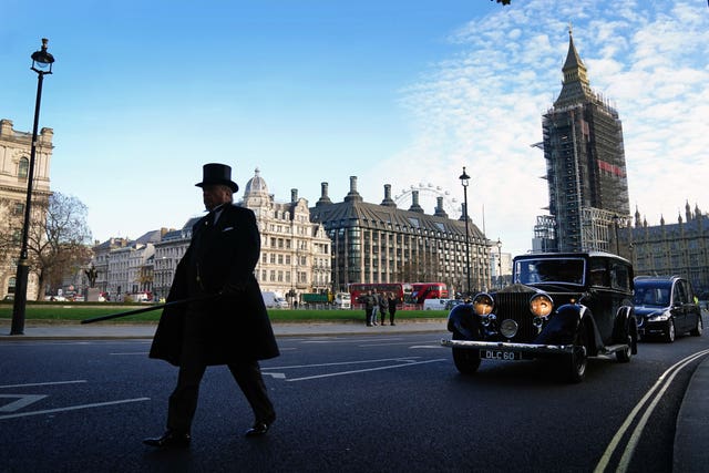 The hearse carrying the coffin of Sir David Amess MP crosses Parliament Square after leaving the Palace of Westminster where it laid in the chapel overnight, ahead of a requiem mass at Westminster Cathedral, central London (Victoria Jones/PA)