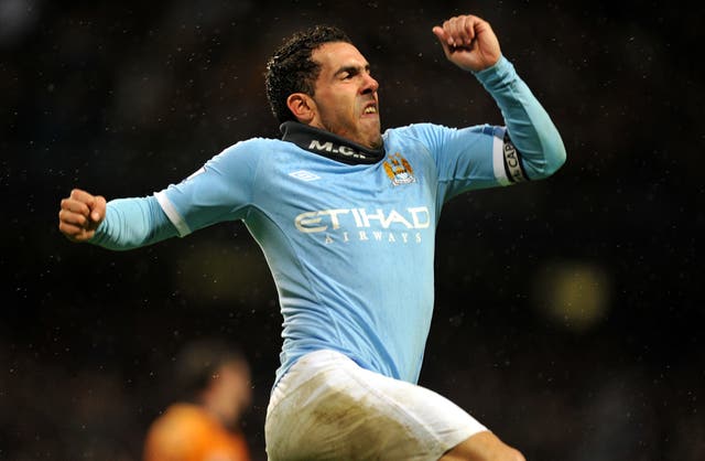 Manchester City's Carlos Tevez celebrates after scoring against Wolves in 2011