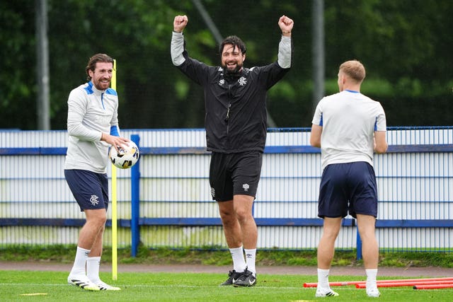 Rangers head coach Russell Martin (centre) and Joe Rothwell (left) during a training session