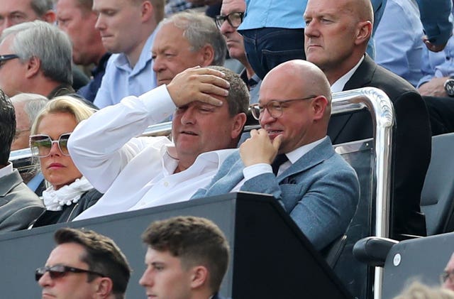 Mike Ashley, left, watches Newcastle lose to Tottenham on last season's opening day