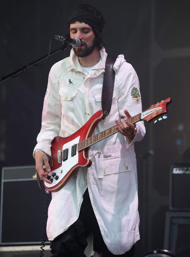 Sergio Pizzorno performing on stage