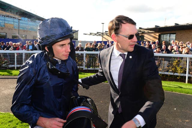 Ryan Moore and Aidan O’Brien after winning the Irish St Leger
