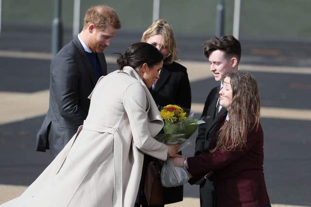 Meghan Markle received flowers outside the Eikon Exhibition Centre in Lisburn (Brian Lawless/PA)
