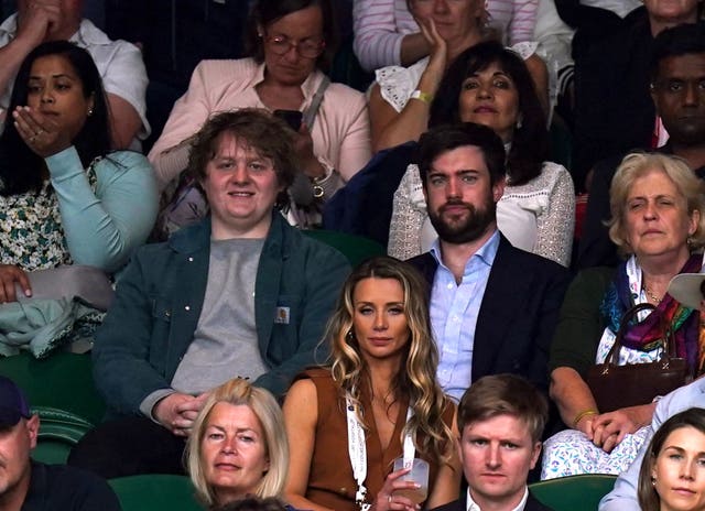 Lewis Capaldi (left) and Jack Whitehall watch play during the Ladies' singles match between Aryna Sabalenka and Ons Jabeur