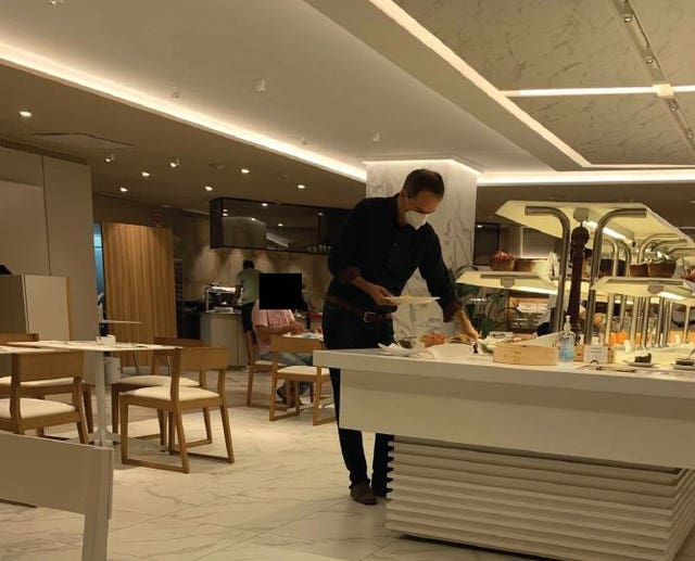 A surveillance image by Gaberova of Christo Grozev at breakfast in the Palace Hotel, Valencia