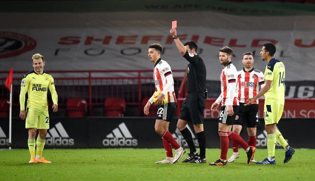 Newcastle's Ryan Fraser is shown a red card