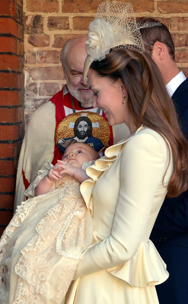 The Duchess of Cambridge carries her son Prince George following his christening (John Stillwell/PA)