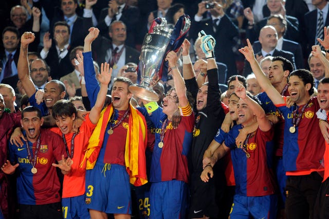 Barcelona's Carles Puyol lifts the Champions League trophy following victory over Manchester United in 2009