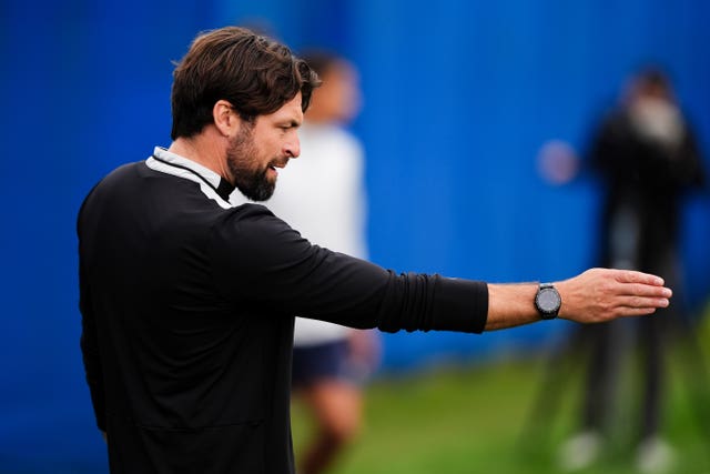 Russell Martin gives instructions with his arm at training