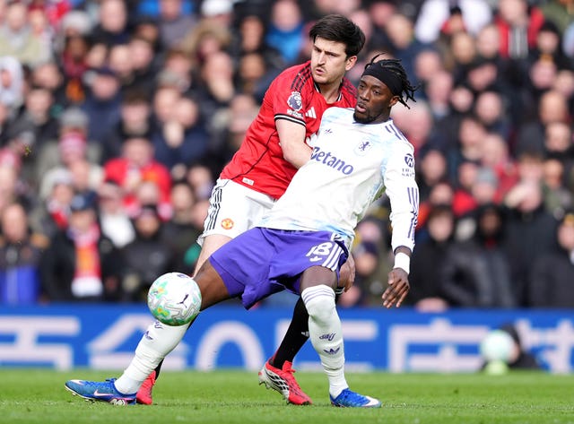 Harry Maguire (left) and Aston Villa’s Tammy Abraham battle for the ball