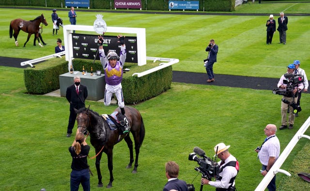 Frankie Dettori leaps from Angel Bleu victory in the Vintage Stakes at Goodwood