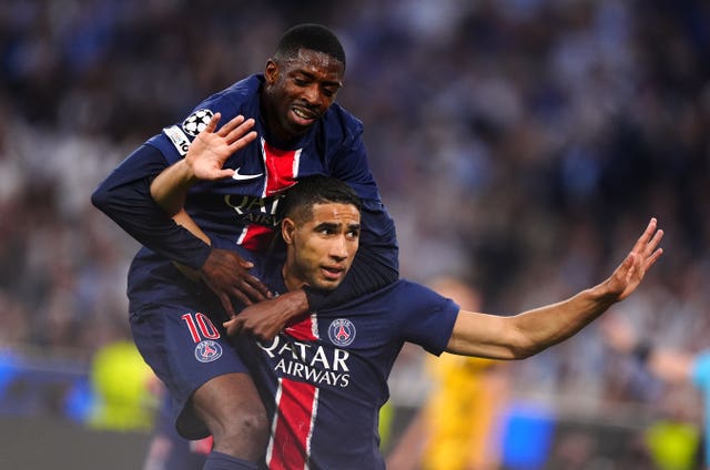 Ousmane Dembele jumps on Achraf Hakimi's back after PSG's first goal