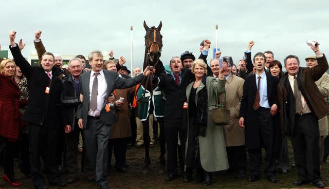 Connections of Dunguib celebrate after winning the Champion Bumper at Cheltenham in 2009