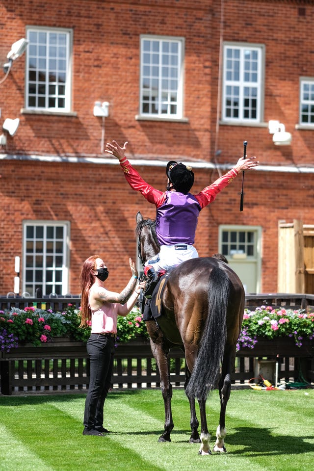 Frankie Dettori celebrates victory with Lightness