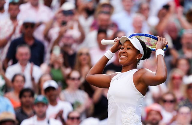 Naomi Osaka smiles after beating Aryna Sabalenka
