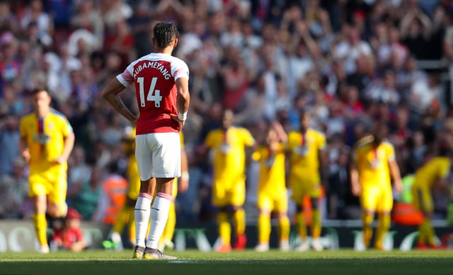 Pierre-Emerick Aubameyang looks on as Crystal Palace celebrate