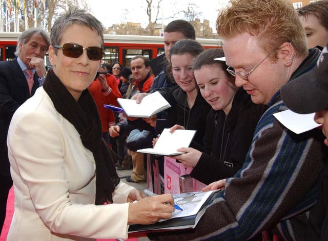 Jamie Lee Curtis signing autographs for fans