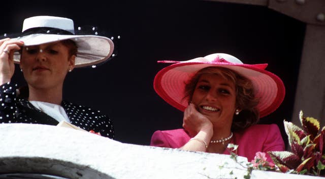 The Duchess of York and the Princess of Wales in the Royal Box at Epson for the Derby in 1987 (PA)