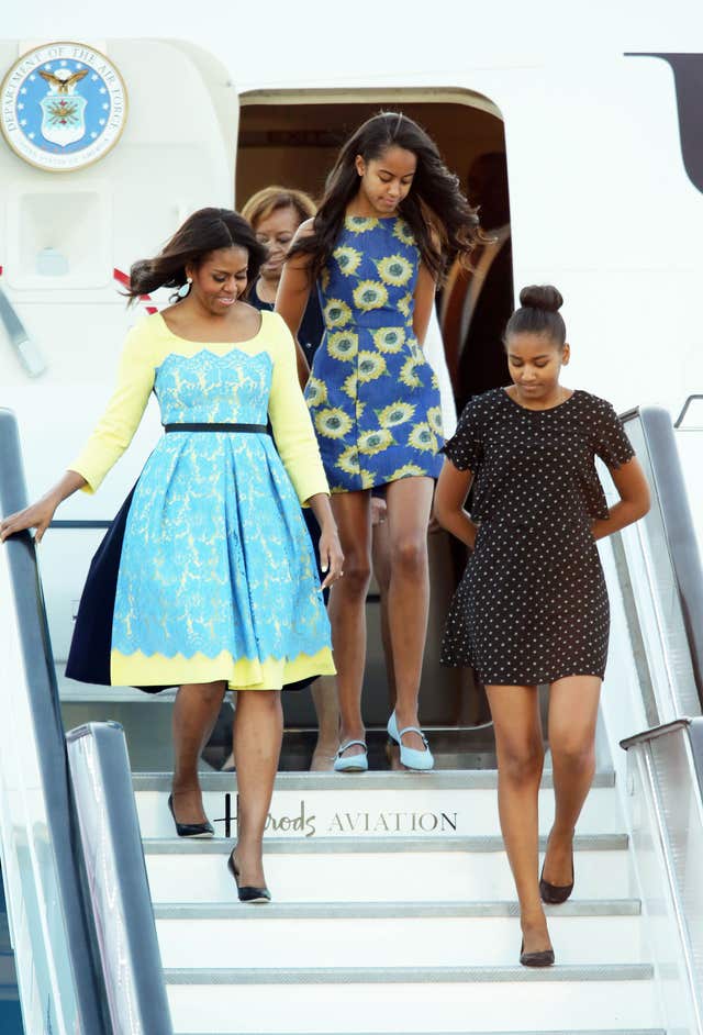 Michelle, Malia and Sasha Obama exiting a plane