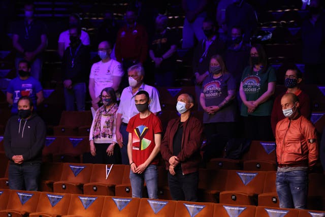 Spectators wearing face masks observed a minutes' silence in memory of the Duke of Edinburgh during the Betfred World Snooker Championships 2021 at The Crucible, Sheffield