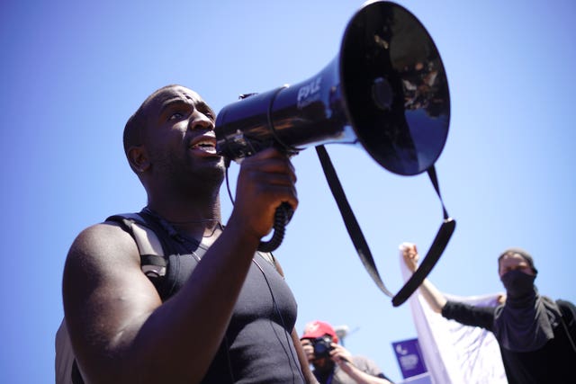 Activist Femi Oluwole addresses the protesters