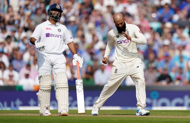 England's Moeen Ali celebrates taking the wicket of India's Virat Kohli 