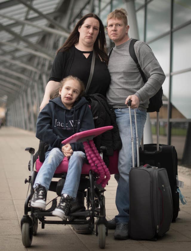 Emma Appleby, Lee Moore and their daughter Teagan