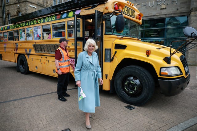 Camilla next to the Bradford Stories Bus