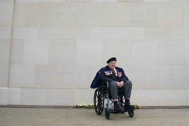 Veteran Ken Hay in front of the new memorial wall at the British Normandy Memorial in Ver-sur-Mer