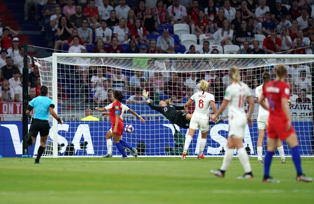 Morgan, red - left, heads USA back in front at 31st minute