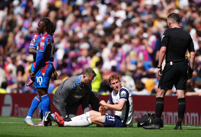 Tottenham’s Dejan Kulusevski receives treatment