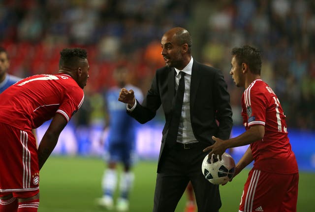 Bayern Munich manager Pep Guardiola (centre). (PA)