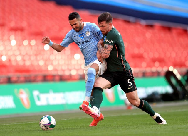 Riyad Mahrez and Tottenham’s Pierre-Emile Hojbjerg battle for the ball