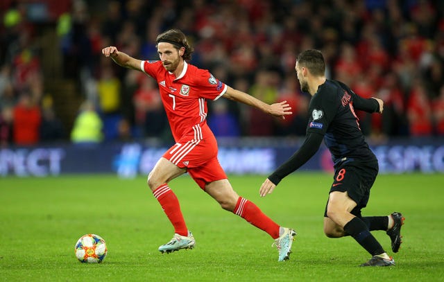 A booking for Joe Allen means he will not feature in Azerbaijan