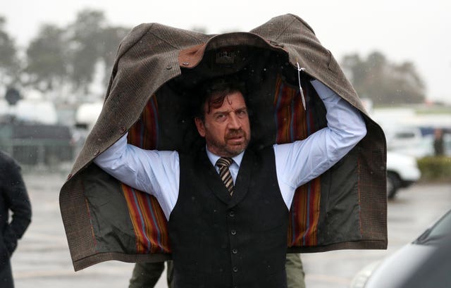 Celebrity Nick Knowles just about managed to keep dry on arrival