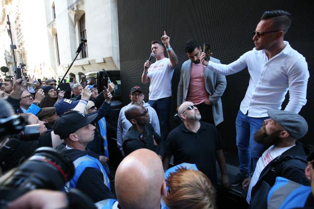 Tommy Robinson speaks to supporters after leaving the Old Bailey