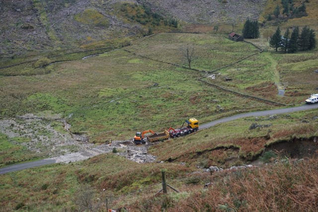 Workmen removing tonnes of material the from Old Military Road