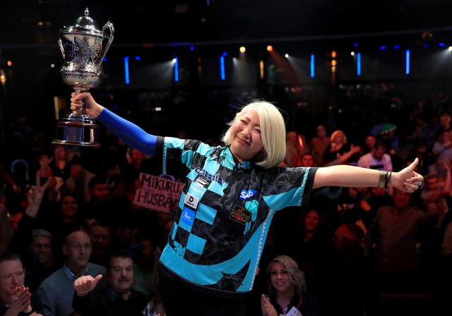 Mikuru Suzuki celebrates winning the women's championship during day eight of the BDO World Professional Darts Championships