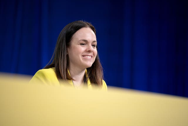 Kate Forbes listens from the stage during an SNP conference event