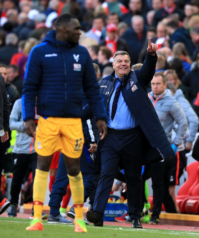 Sam Allardyce celebrates after Christian Benteke, left, earned Crystal Palace victory at Anfield