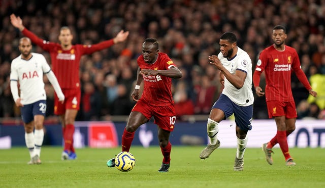 Japhet Tanganga battles for the ball 