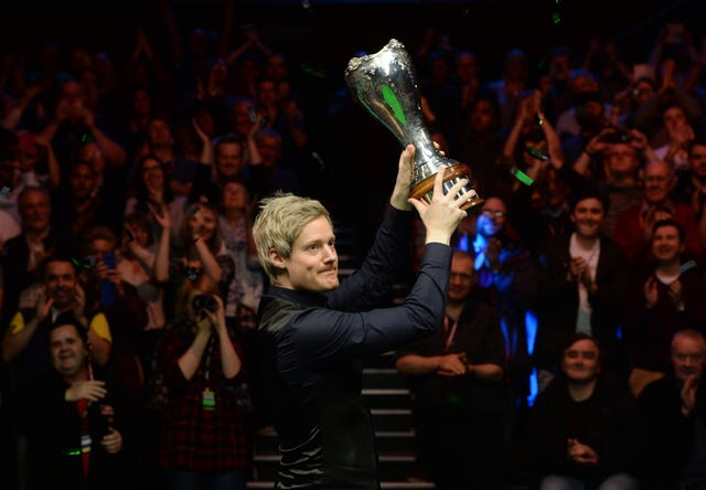 Neil Robertson celebrates with the UK Championship trophy